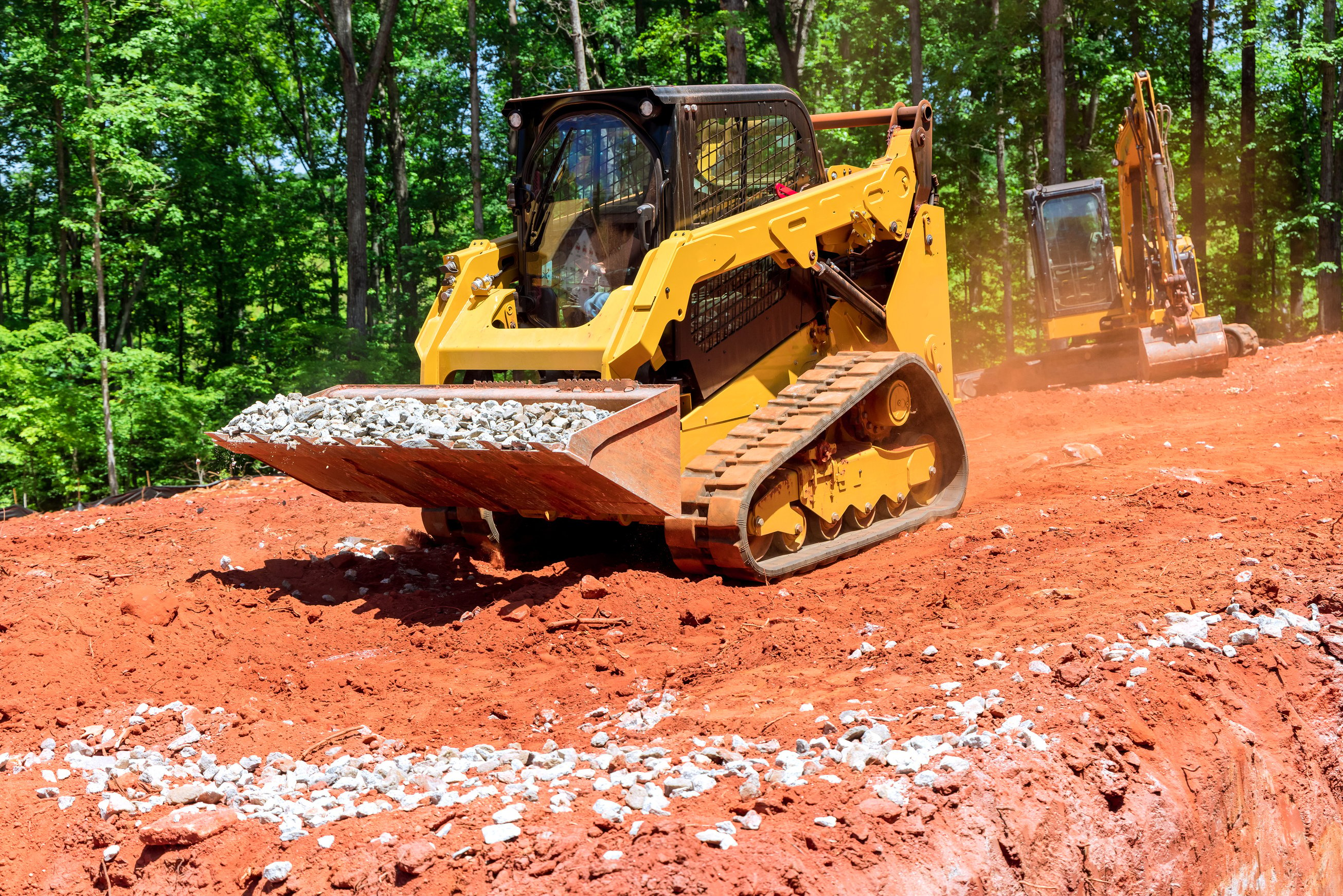 Excavation at a Construction Site, Mini Loader Bobcat Transports Crushed Stone to Different Construction