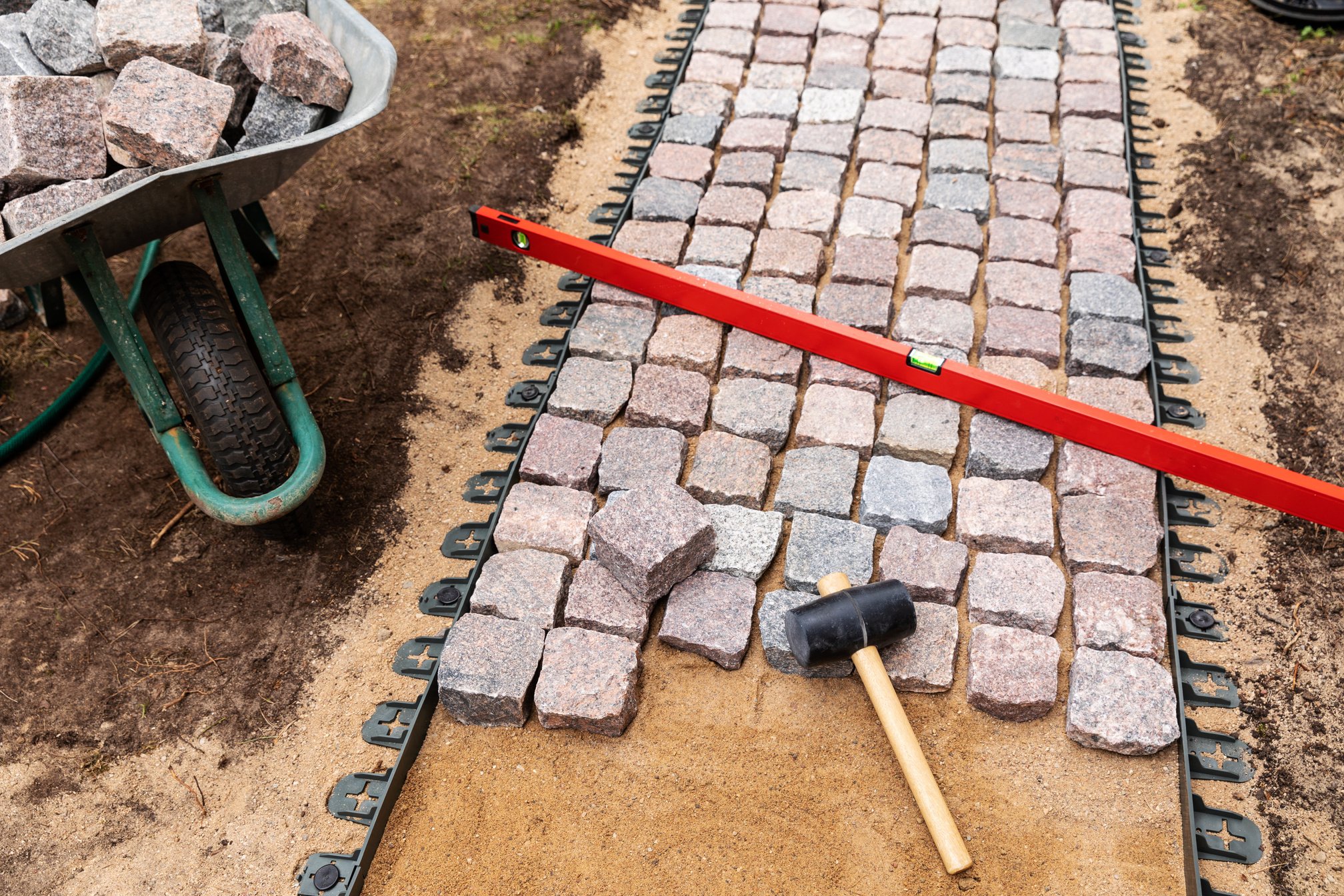 landscaping and garden services - granite cobblestone walkway construction